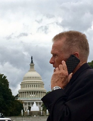 Chapter 7 bankruptcy attorney Stephen Brittain Talking on phone Chapter 7 bankruptcy attorney Stephen Brittain Talking on phone